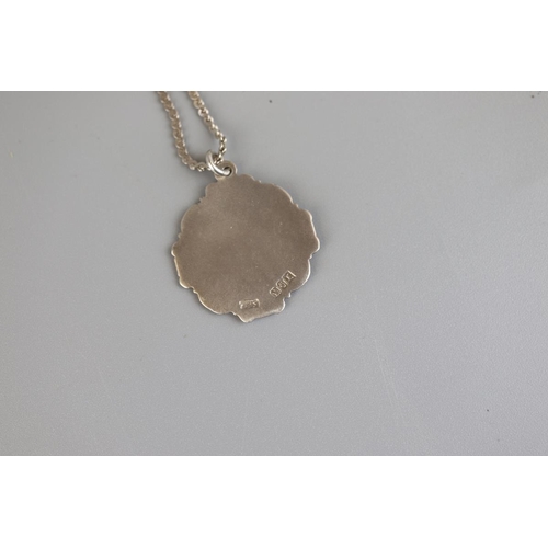 148 - Silver pendant with gold inlay on silver chain