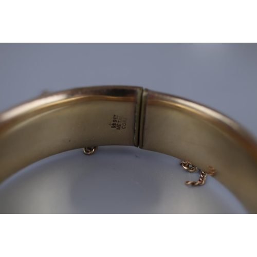 155 - 2 bangles, 1 with Birmingham silver hallmark, the other marked 1/5 9ct metal core