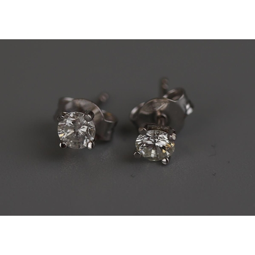 164 - Pair of 18ct white gold diamond stud earrings