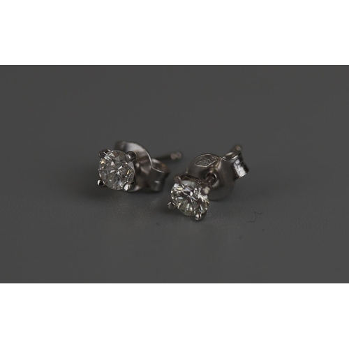 164 - Pair of 18ct white gold diamond stud earrings