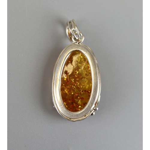 38 - Silver & amber pendant