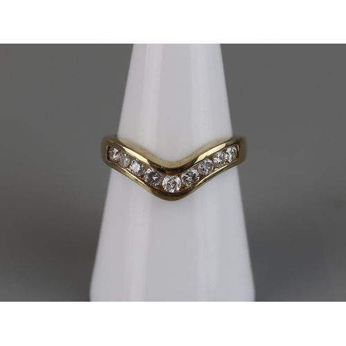 69 - Gold channel set diamond wishbone ring - Approx size M