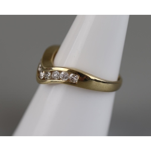 69 - Gold channel set diamond wishbone ring - Approx size M