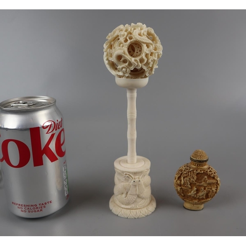 142 - Ivory puzzle ball on stand together with resin sent bottle