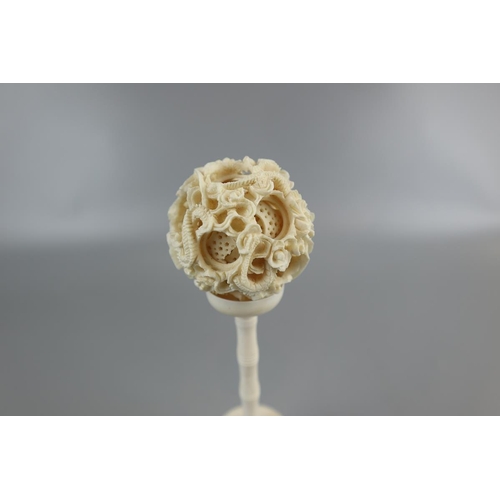 142 - Ivory puzzle ball on stand together with resin sent bottle