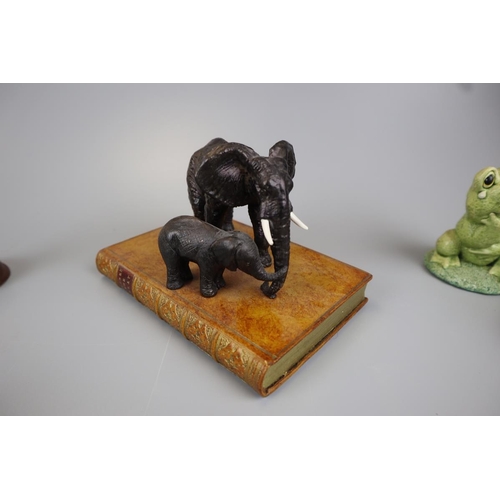 129 - Collection of elephant and frog figures