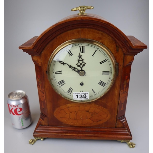 138 - Inlaid mantel clock on brass claw feet