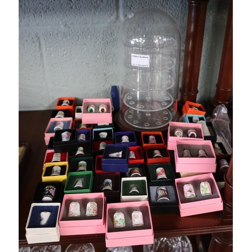 142 - Large collection of thimbles and thimble stand to include COA's