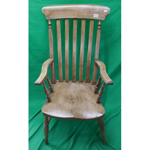 492 - Slat back elm seated kitchen armchair marked GWR