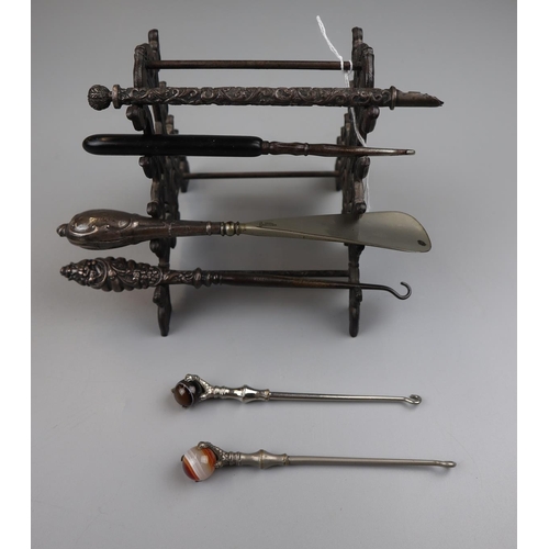 82 - Interesting stand with button hooks, shoehorns etc to include silver handled examples