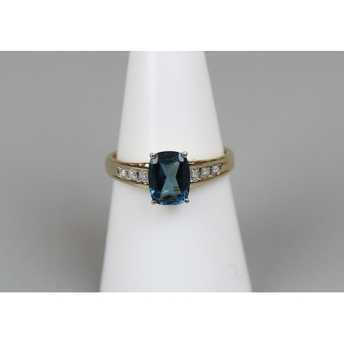12 - Gold Blue Topaz & Diamond set ring - Approx. size N