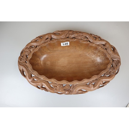 146 - Oriental carved oval wooden dragon bowl