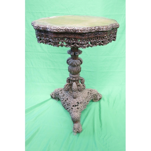 179 - Intricately carved tripod table