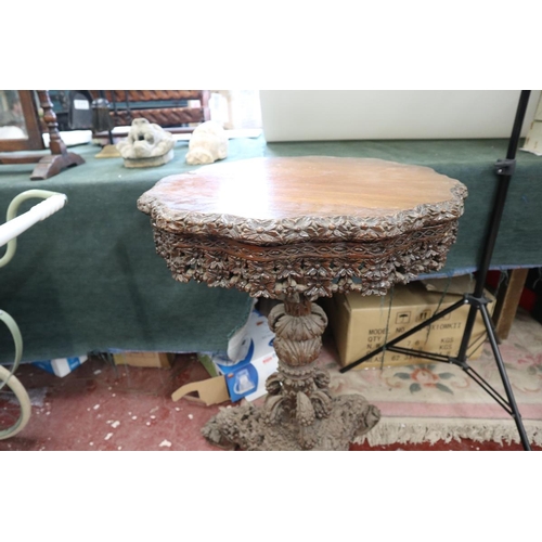 179 - Intricately carved tripod table