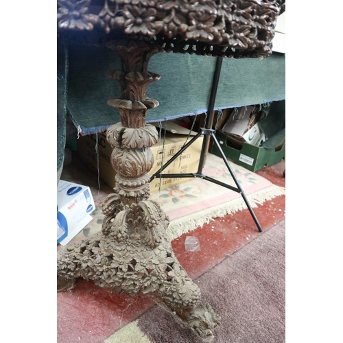 179 - Intricately carved tripod table