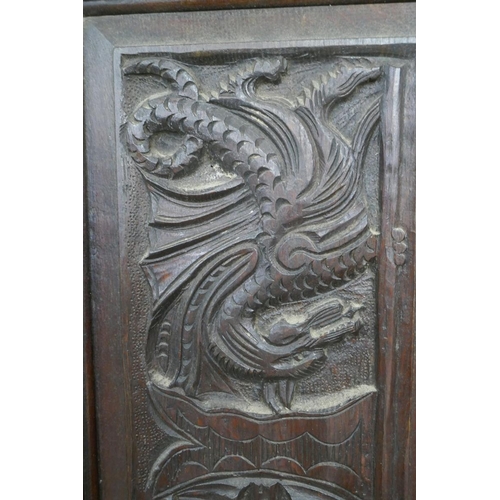 254 - Tall antique carved oak corner cupboard