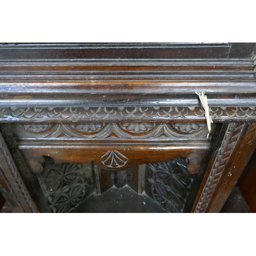 254 - Tall antique carved oak corner cupboard