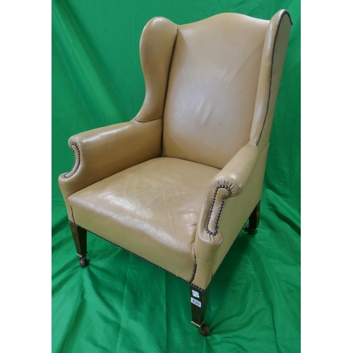 430 - Leather wing-back armchair