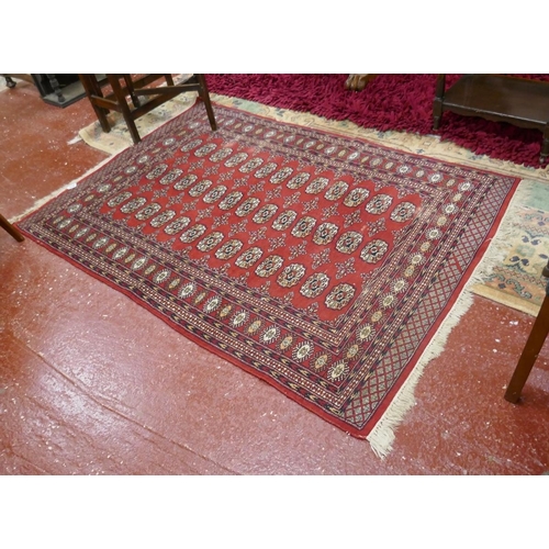 438 - Red & blue Eastern patterned rug - 189cm x 128cm