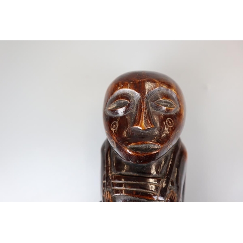 94 - Unusual heavy carved African figure - Approx. height 23cm