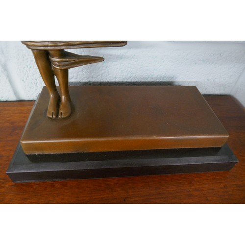 256 - Bronze wind blown figure on marble base - Approx. height 36cm