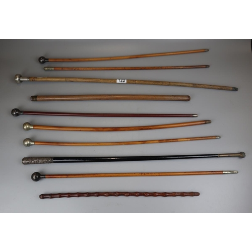 122 - Collection of 11 swagger sticks to include silver mounted examples