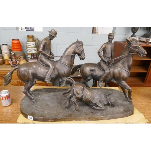 282 - Large bronze of men on horseback herding cattle - Approx length 92cm