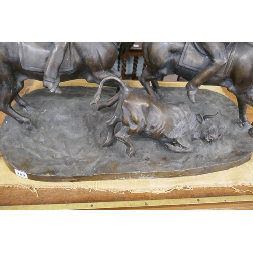 282 - Large bronze of men on horseback herding cattle - Approx length 92cm