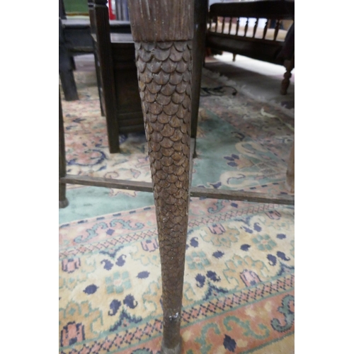 371 - Carved oak occasional table with merman themed legs