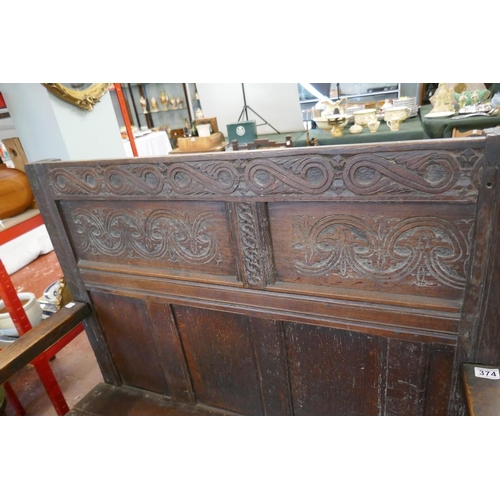 374 - Early carved oak settle - Approx L: 117cm W: 63cm H: 124cm