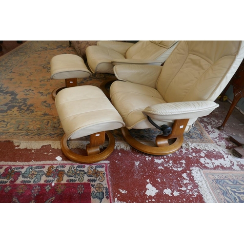 396 - Pair of Stressless reclining leather chairs with matching stools