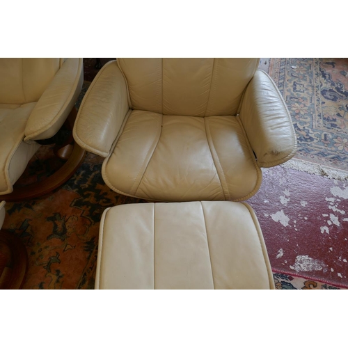 396 - Pair of Stressless reclining leather chairs with matching stools