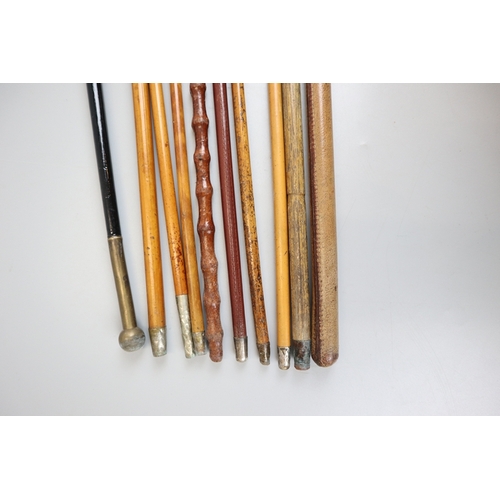 122 - Collection of 11 swagger sticks to include silver mounted examples