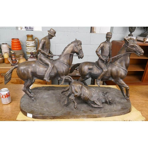 269 - Large bronze herding cattle on horse back - Approx length 92cm