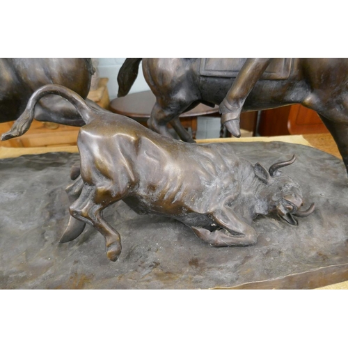 269 - Large bronze herding cattle on horse back - Approx length 92cm