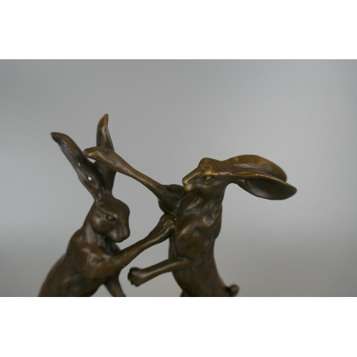 275 - Bronze boxing hares on marble - Approx height 24cm