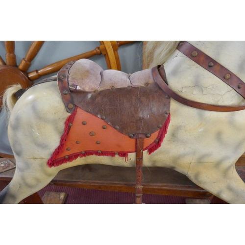 318 - Antique J Collinson and Sons of Liverpool hand carved wooden rocking horse with original saddle and ... 