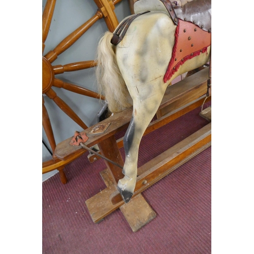 318 - Antique J Collinson and Sons of Liverpool hand carved wooden rocking horse with original saddle and ... 