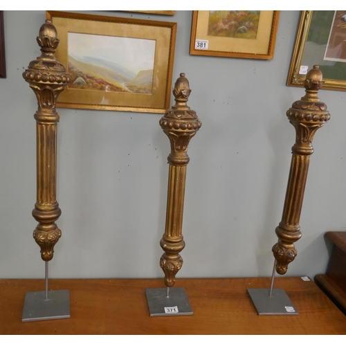 371 - 3 decorative gilt columns on stands