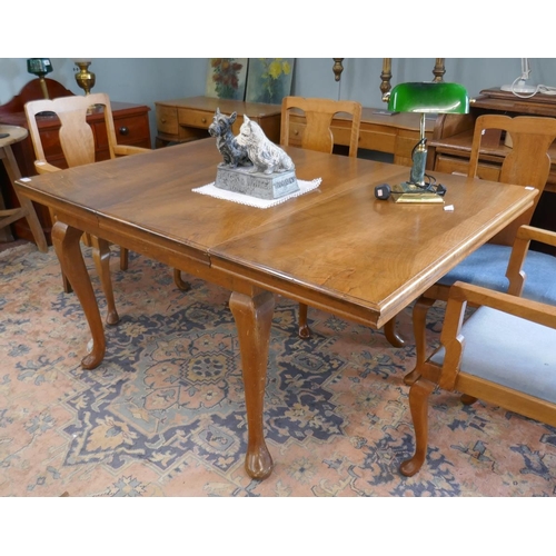 373 - Walnut extending pad foot dining table - Approx size L: 150cm W: 108cm H: 76cm