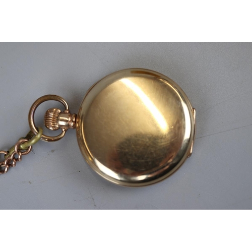 62 - Pocket watch in yellow metal Dennison Star case with a 9ct gold chain (approx weight of chain 29g)