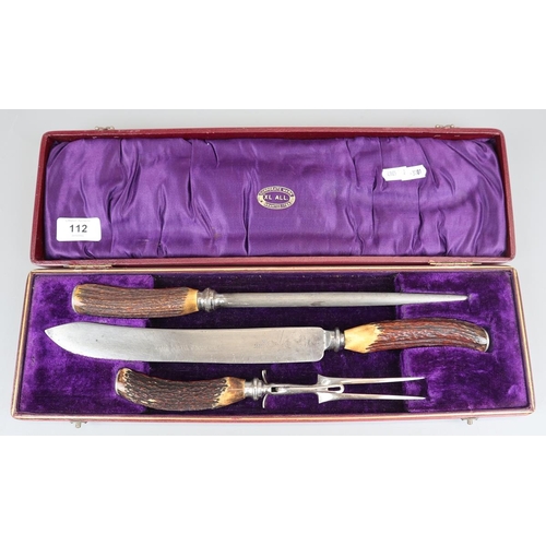 112 - Cased horn handled carving set