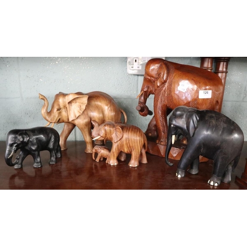 126 - Collection of carved wooden elephant ornaments