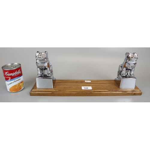 144 - 2 Mack mascots mounted on oak to form book stand