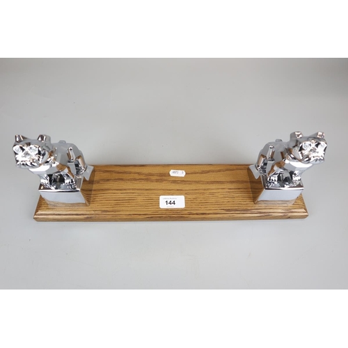 144 - 2 Mack mascots mounted on oak to form book stand