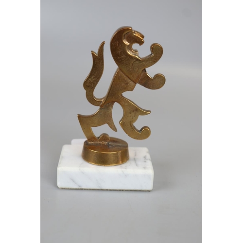 189 - Brass lion mascot mounted on marble base 