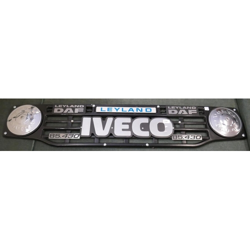 234 - Collection of badges to include Iveco, Volvo and Leyland mounted on a grill