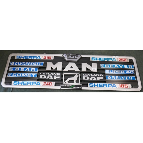 236 - Collection of badges to include Leyland DAF, Sherpa and MAN mounted on a grill