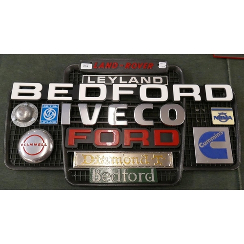 239 - Collection of badges to include Bedford, Iveco, Cummins mounted on Land Rover grill