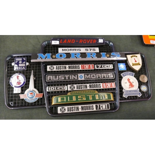 242 - Collection of badges to include mostly Austin Morris and RHA mounted on Land Rover grill